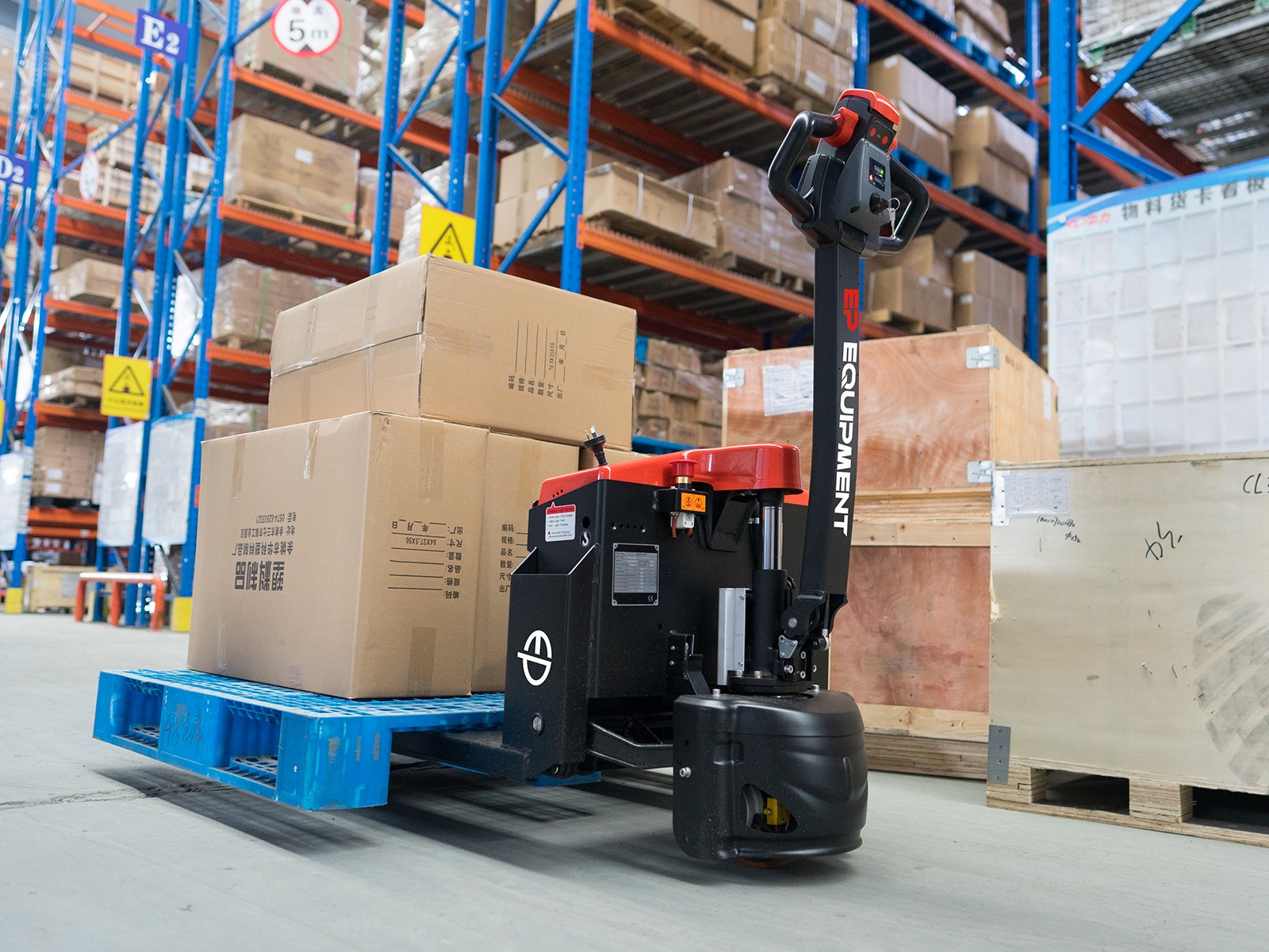EPT20-15ET2 electric pallet truck being used in a warehouse.